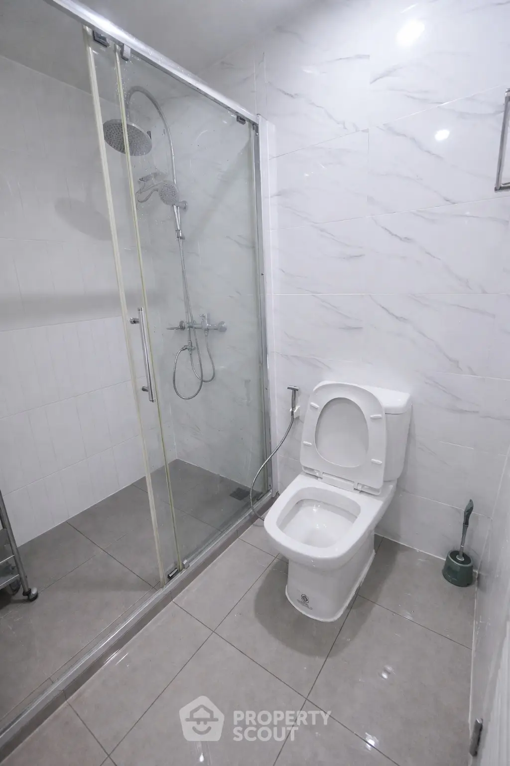 Modern bathroom with glass shower and sleek tile design