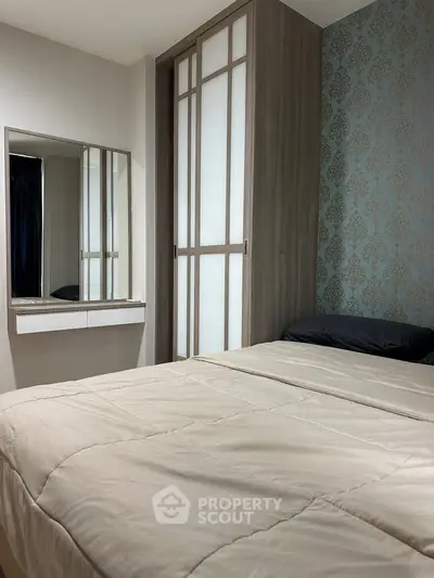 Cozy bedroom with elegant wallpaper and modern wardrobe design