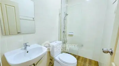 Modern bathroom with glass shower and sleek fixtures