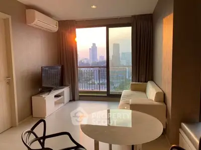 Modern living room with city view, featuring sleek furniture and large windows.
