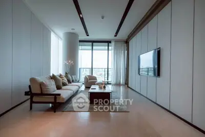 Luxurious modern living room with floor-to-ceiling windows and elegant decor.