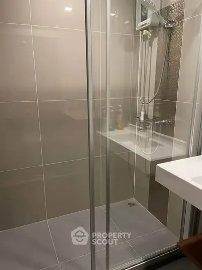 Modern bathroom with sleek shower enclosure and stylish fixtures