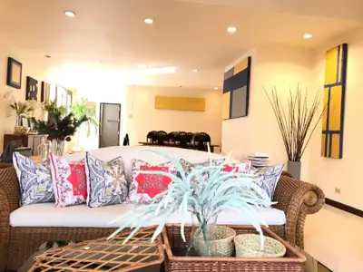 Spacious living room with elegant decor and modern furniture, perfect for relaxation and entertaining guests.