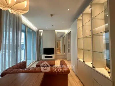 Luxurious living room with elegant decor and large windows offering ample natural light.