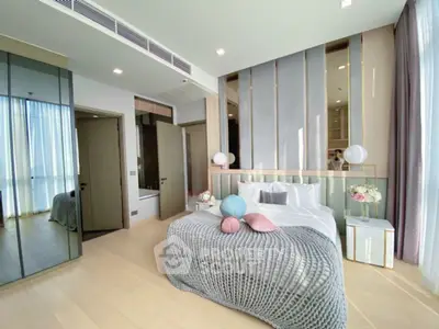 Luxurious modern bedroom with elegant decor and ample natural light