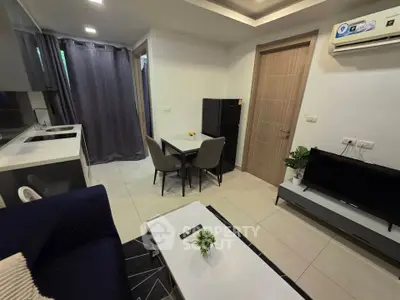Modern compact living room with open kitchen and sleek furniture