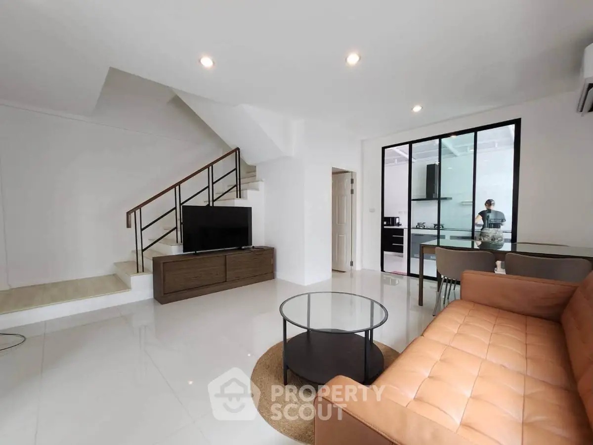 Modern living room with sleek design, open layout, and stylish furniture in a contemporary home.