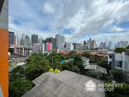 Stunning cityscape view with lush greenery and modern skyline, perfect for urban living enthusiasts.