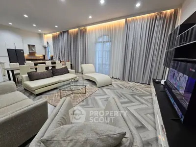 Luxurious modern living room with elegant decor and open kitchen layout