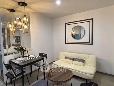 Modern living room with stylish lighting and cozy dining area