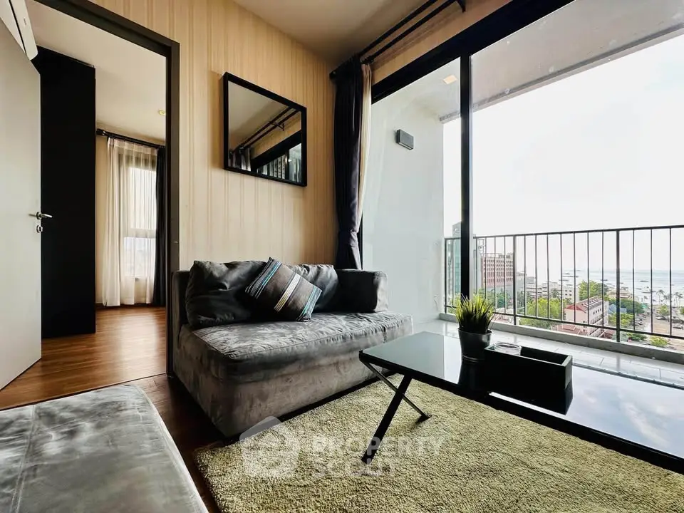 Modern living room with stunning city view and cozy seating area