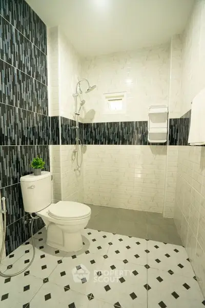 Modern bathroom with stylish tile design and shower area
