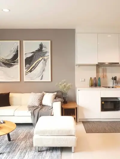 Modern living room with stylish decor and open kitchen layout