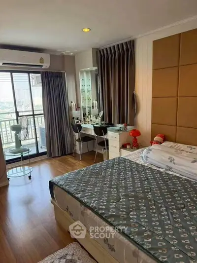 Cozy bedroom with balcony access and stylish decor in modern apartment