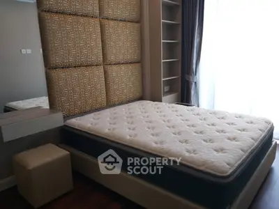 Modern bedroom with stylish headboard and natural light