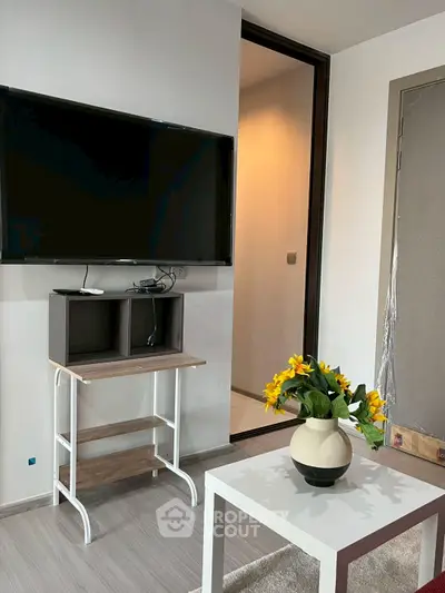 Modern living room with wall-mounted TV and stylish decor