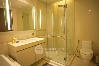 Luxurious modern bathroom with glass shower and elegant fixtures