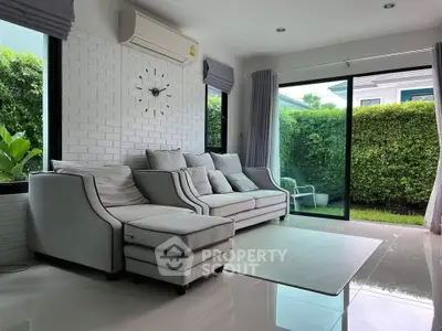 Modern living room with garden view and stylish furniture