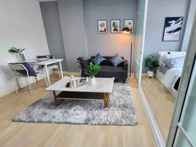 Modern living room with cozy decor and adjacent bedroom in stylish apartment