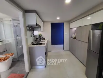 Modern kitchen with sleek cabinetry and stainless steel appliances