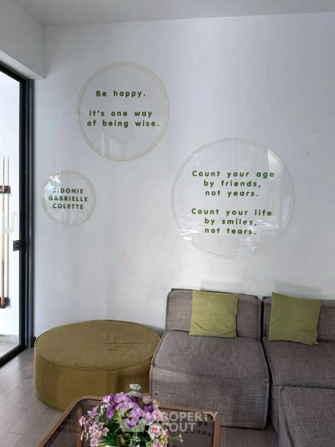 Stylish living room with modern decor and motivational wall quotes