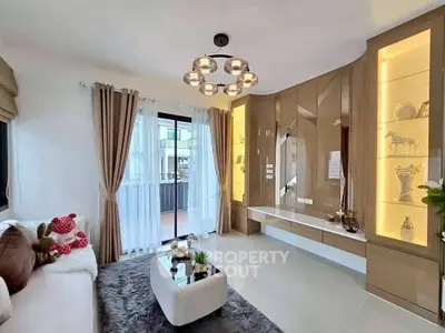 Modern living room with elegant decor and large window for natural light