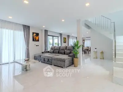 Luxurious modern living room with elegant gray sofa and stylish decor