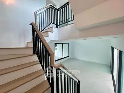 Modern duplex interior with stylish staircase and open living area