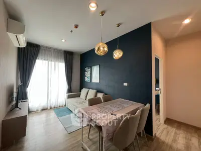 Modern living room with stylish decor, cozy sofa, and elegant dining area in a chic apartment.