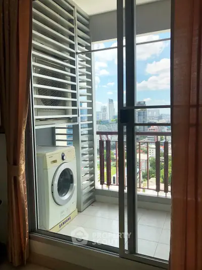 Modern apartment balcony with washing machine and city view, perfect for urban living.