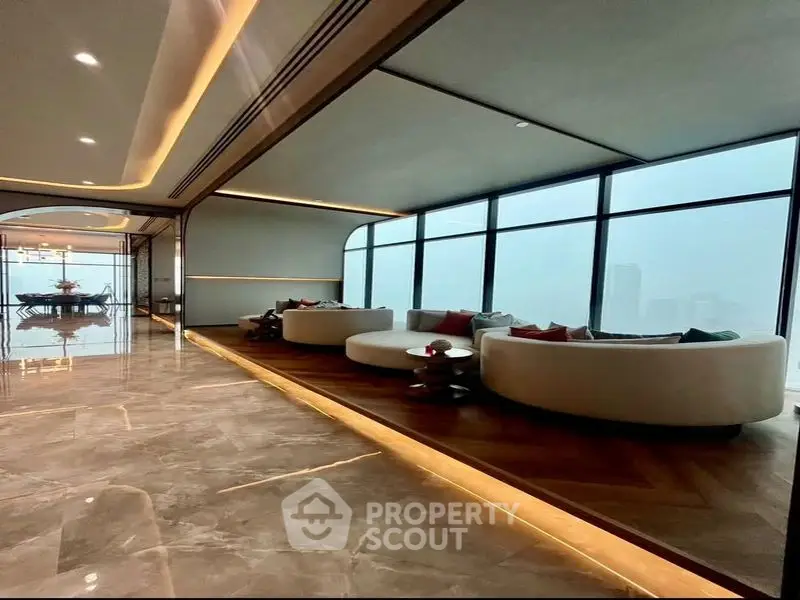 Luxurious modern living room with panoramic city views and elegant furnishings