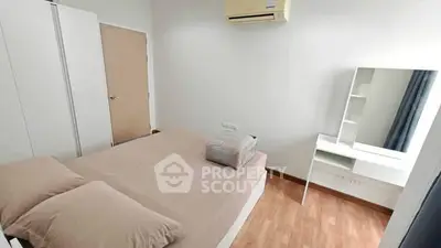 Modern bedroom with air conditioning and stylish furniture