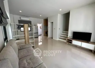 Spacious modern living room with sleek design and natural light