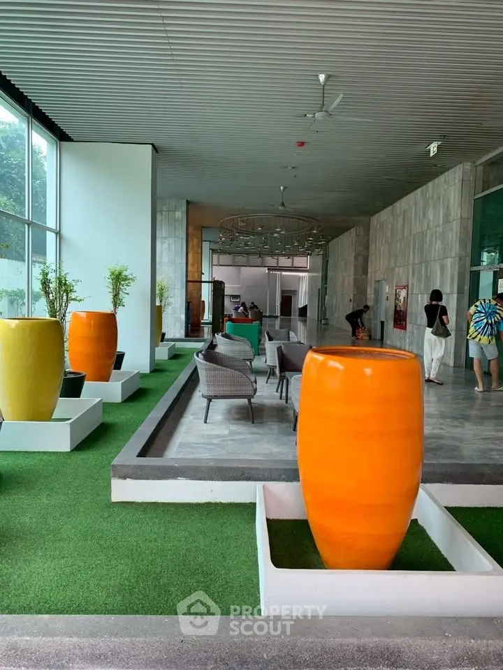 Modern building entrance with vibrant decor and seating area