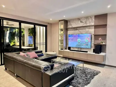 Modern living room with sleek leather sofa and stylish entertainment center