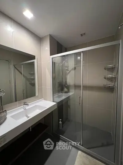 Modern bathroom with sleek shower and elegant sink design