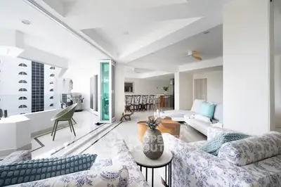 Spacious modern living room with open layout and stylish decor in luxury apartment