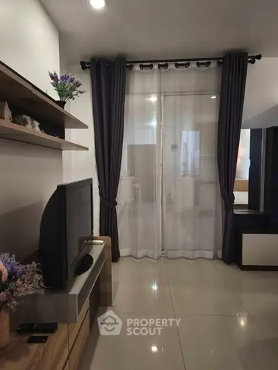 Modern living room with sleek TV setup and elegant curtains