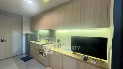 Modern kitchen with sleek cabinetry and built-in appliances in a compact layout.