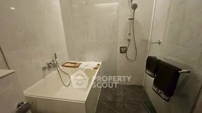 Luxurious marble bathroom with modern bathtub and shower