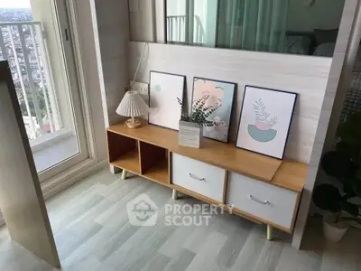 Stylish interior corner with modern decor and balcony view, perfect for urban living.