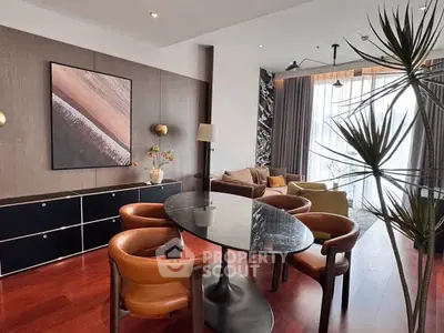 Stylish modern living room with elegant dining area and large windows for natural light.