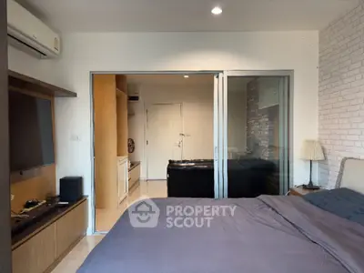 Modern bedroom with sliding glass doors and stylish decor