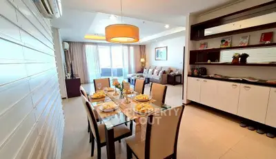 Spacious dining and living area with elegant decor and ample natural light.