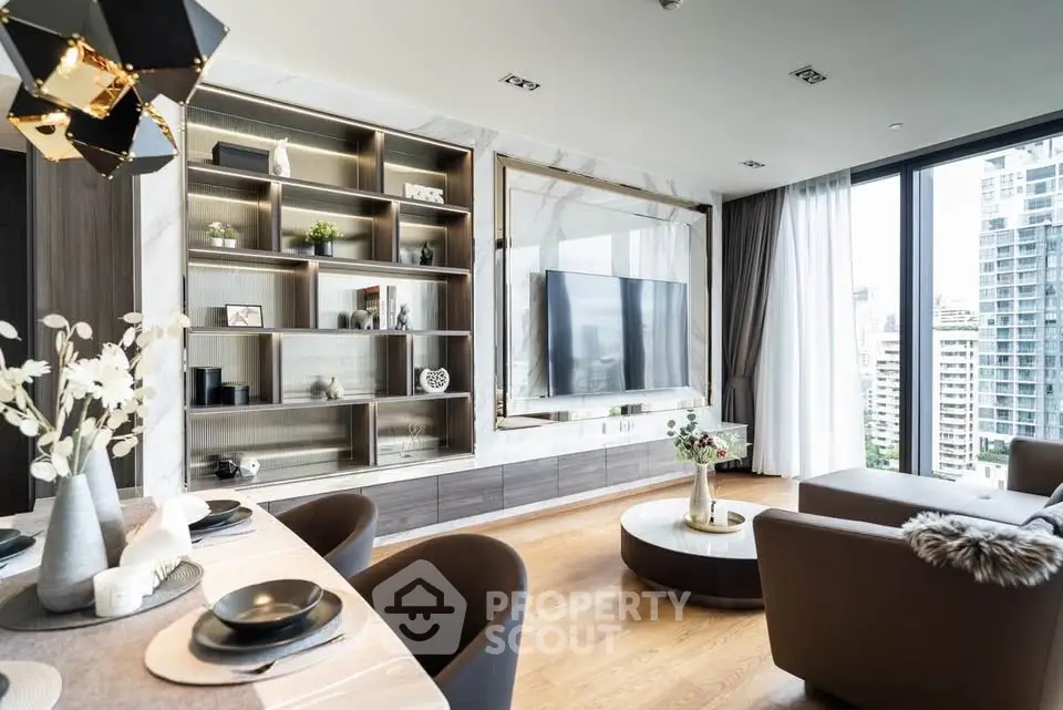 Luxurious modern living room with elegant decor and city view, featuring a stylish entertainment center and cozy seating.