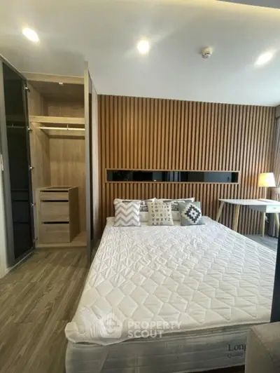 Modern bedroom with stylish wood paneling and cozy decor