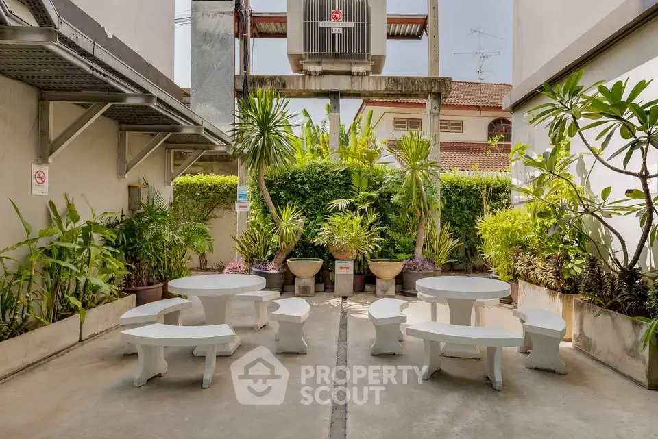 Charming outdoor garden area with seating, perfect for relaxation and gatherings.