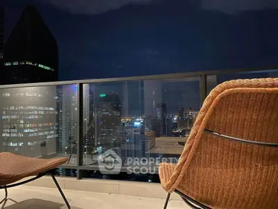 Stunning cityscape view from a modern balcony at night, perfect for urban living enthusiasts.