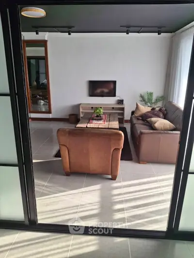 Stylish living room with leather sofas and modern decor