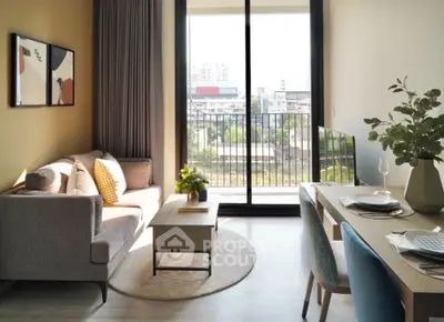 Modern living room with balcony view, stylish furniture, and natural light